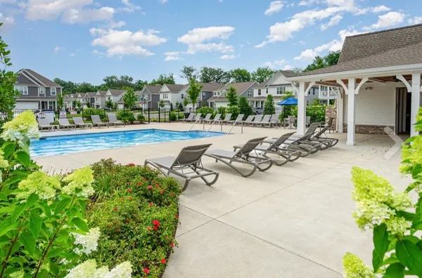 a view of a swimming pool and lounge chair