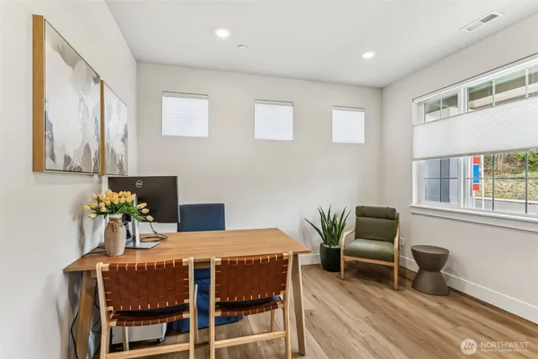 a dining room with furniture and window