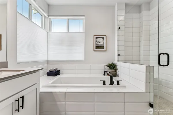 a bathroom with a bathtub and a sink