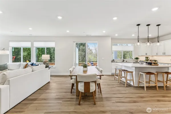 a large kitchen with a table and chairs
