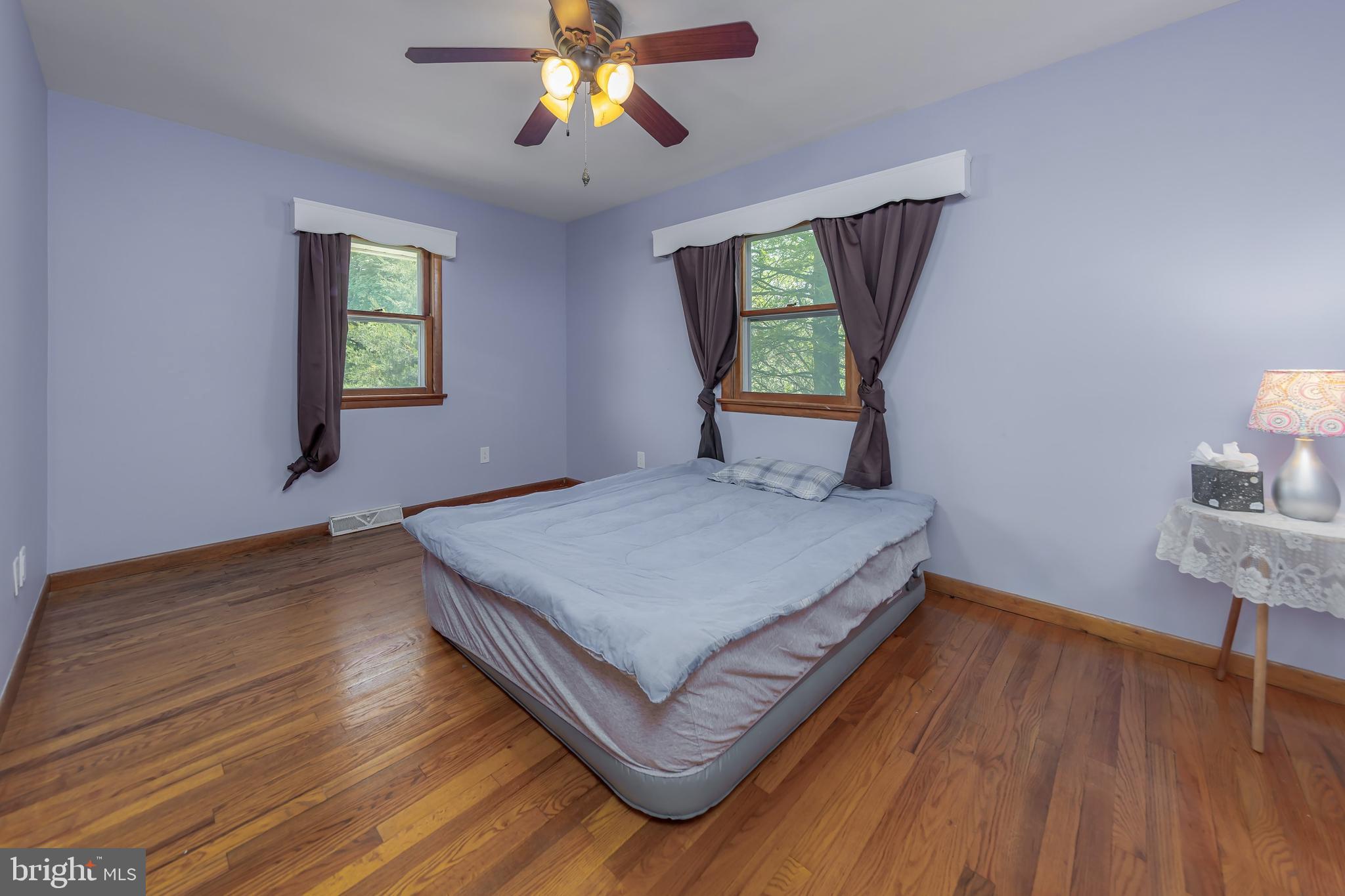 121 Kansas Road Pennsville, NJ 08070 - Photo 14 of 32 a bedroom with a bed and a window