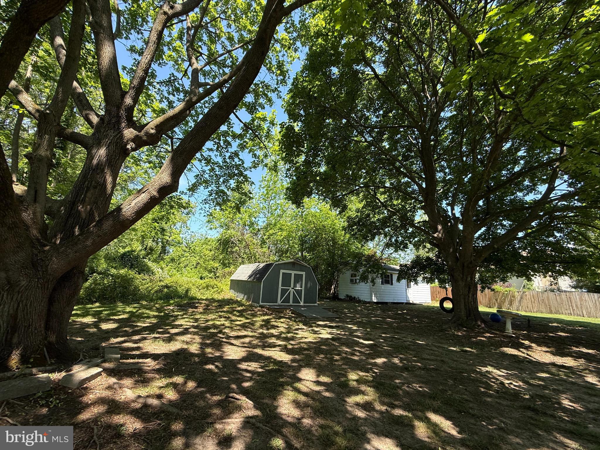 121 Kansas Road Pennsville, NJ 08070 - Photo 28 of 32 a view of a tree in front of a house