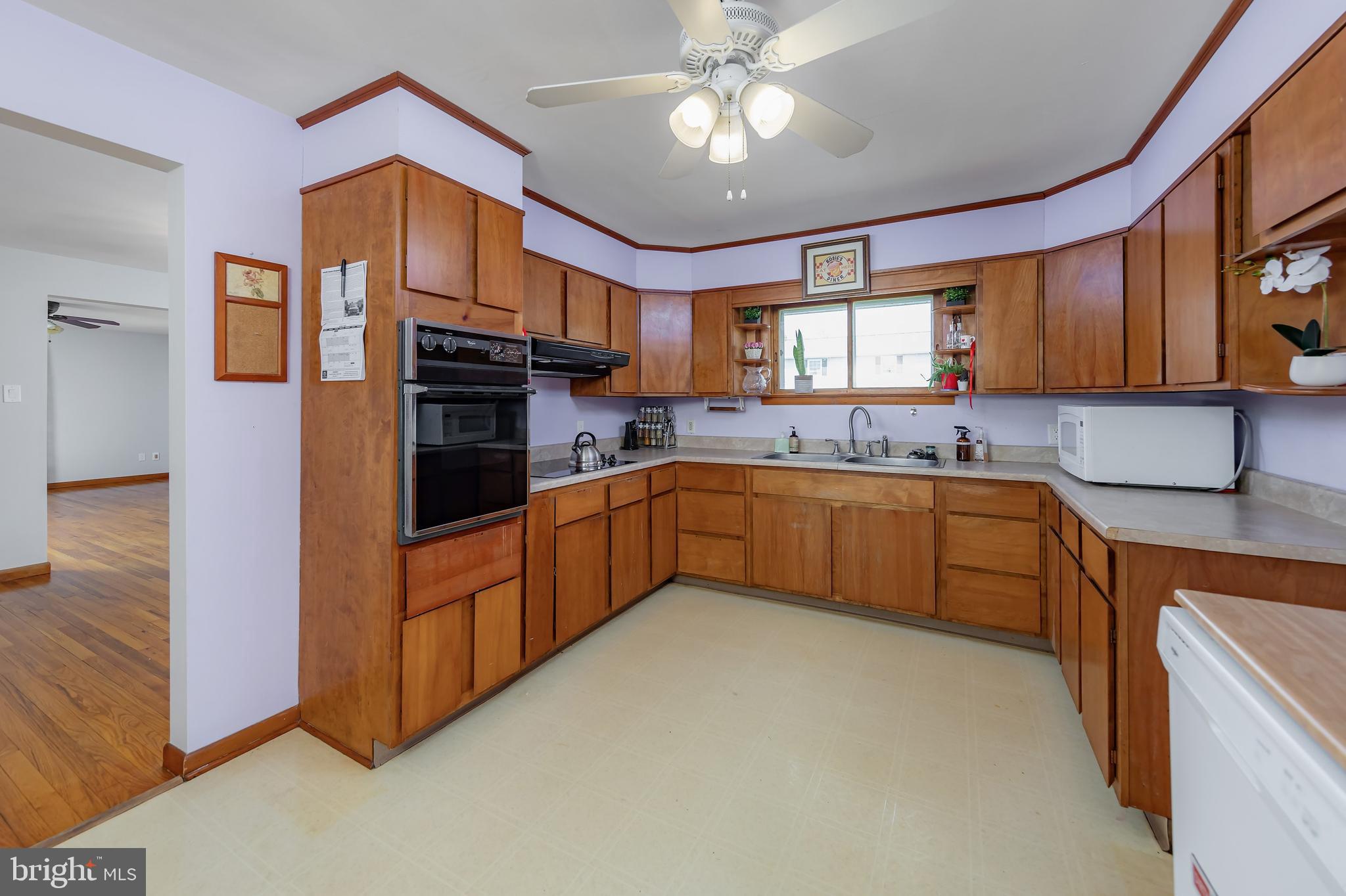121 Kansas Road Pennsville, NJ 08070 - Photo 7 of 32 a kitchen with stainless steel appliances granite countertop a sink and cabinets