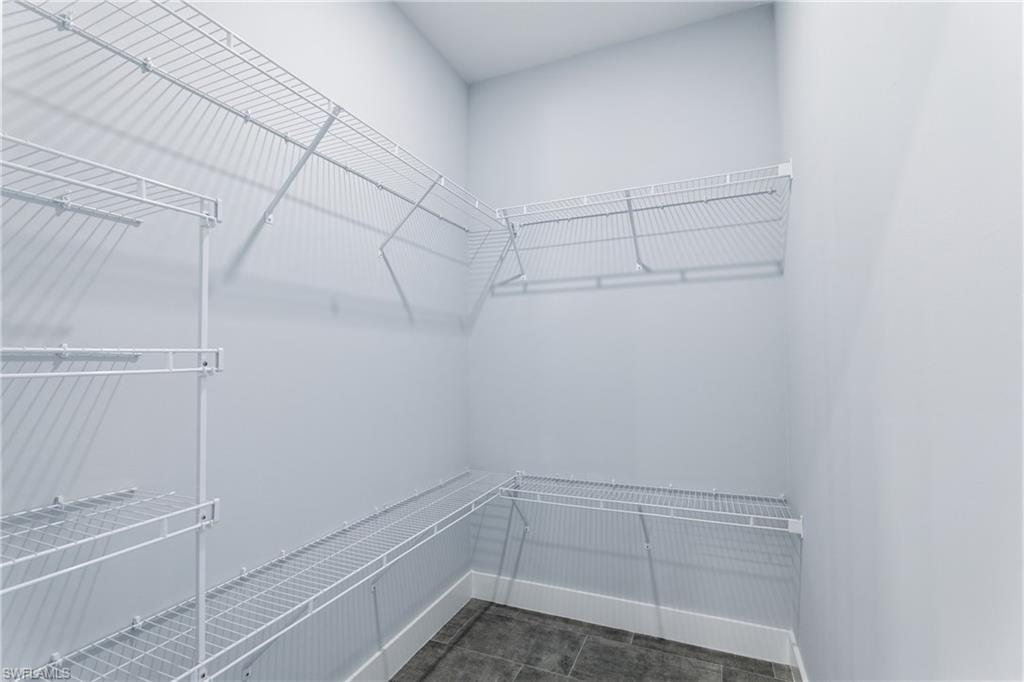 19871 Adams Road Fort Myers, FL 33908 - Photo 16 of 25 walk-in closet: primary bathroom