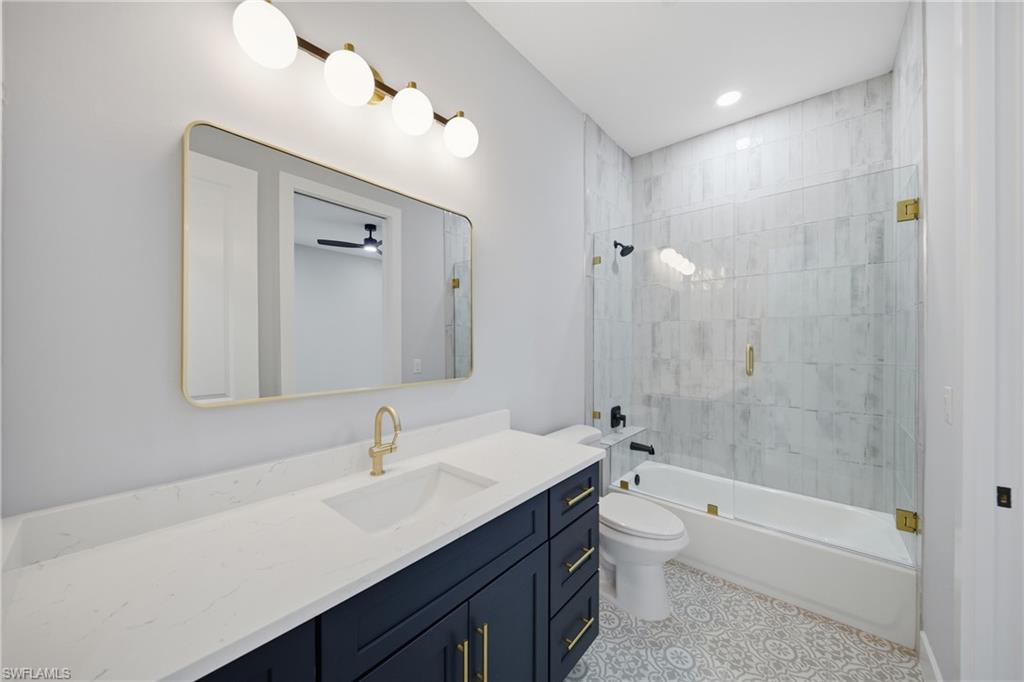 19871 Adams Road Fort Myers, FL 33908 - Photo 17 of 25 Guest bath with frameless shower door