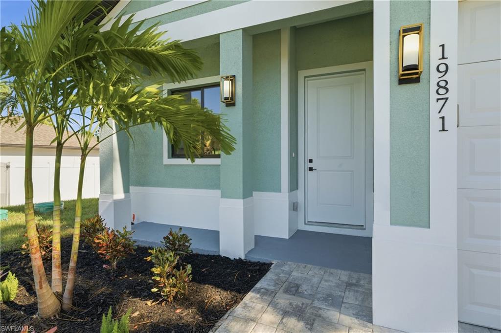 19871 Adams Road Fort Myers, FL 33908 - Photo 2 of 25 Front entrance with covered porch area