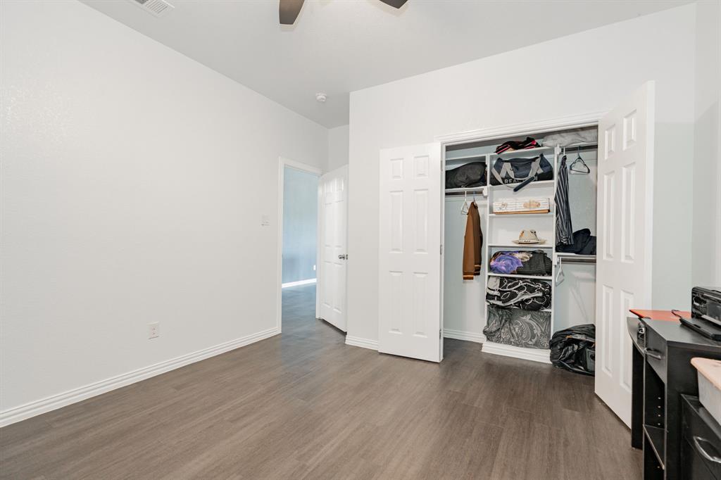641 Countess Road Quinlan, TX 75474 - Photo 11 of 35 a view of a storage & utility room with wooden floor