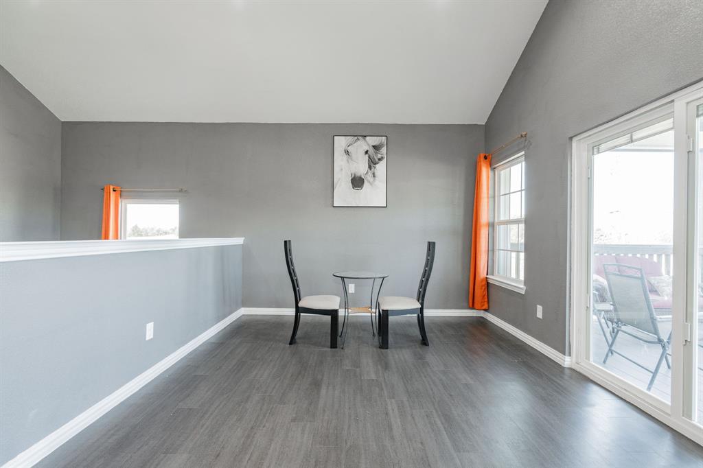 641 Countess Road Quinlan, TX 75474 - Photo 15 of 35 a view of a dining room with furniture and wooden floor