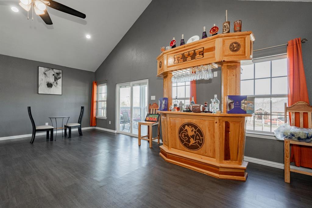 641 Countess Road Quinlan, TX 75474 - Photo 16 of 35 a front door with furniture and wooden floor