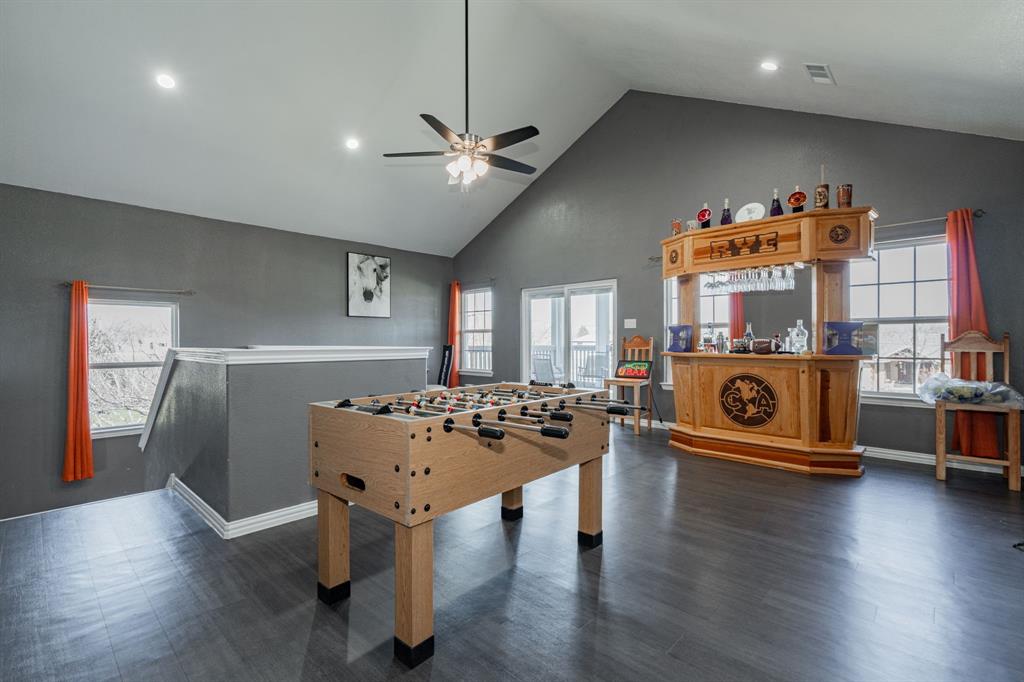 641 Countess Road Quinlan, TX 75474 - Photo 18 of 35 a living room with furniture and a wooden floor
