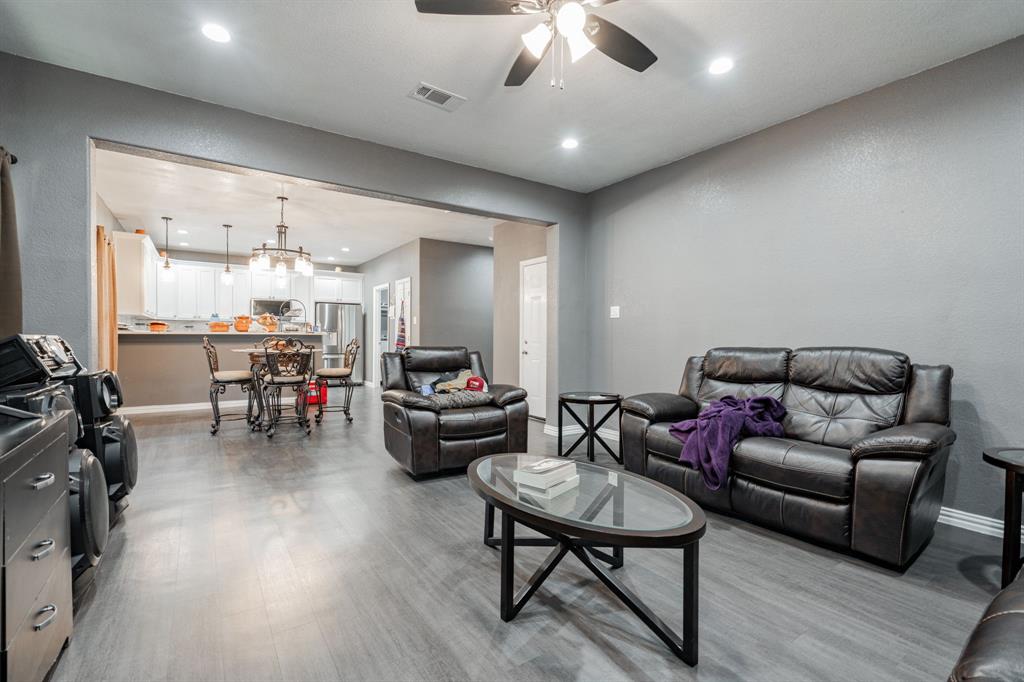 641 Countess Road Quinlan, TX 75474 - Photo 23 of 35 a living room with furniture and a flat screen tv