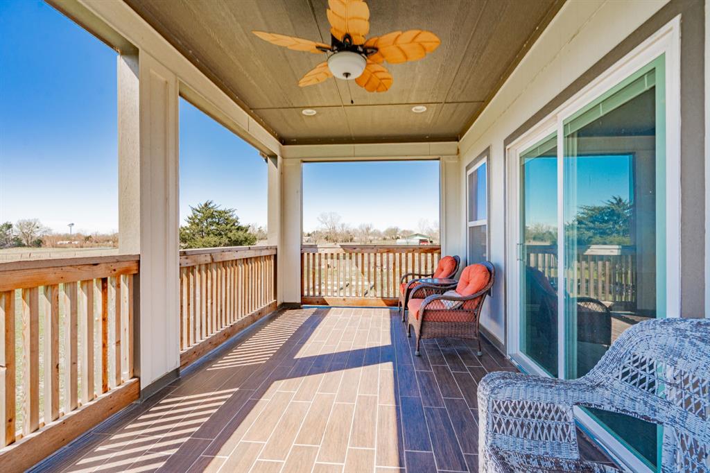 641 Countess Road Quinlan, TX 75474 - Photo 29 of 35 a balcony with furniture and wooden floor
