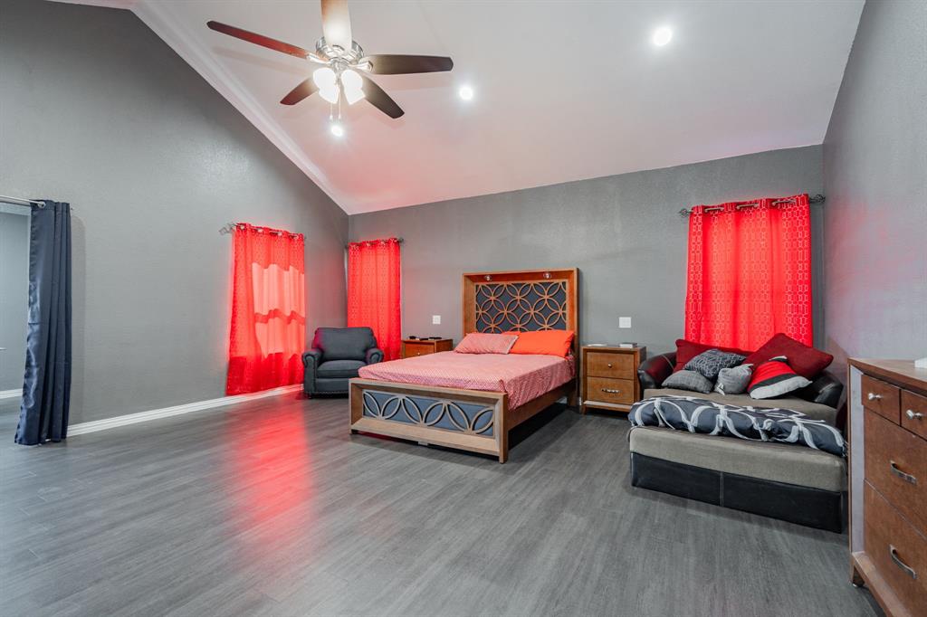 641 Countess Road Quinlan, TX 75474 - Photo 9 of 35 a bedroom with furniture window and a ceiling fan