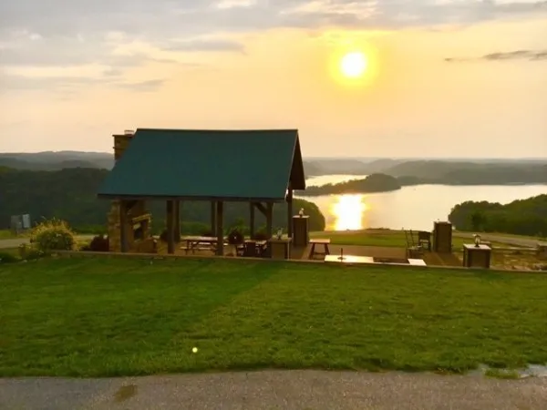 a view of a lake with lawn chairs