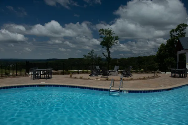 a view of swimming pool with seating area