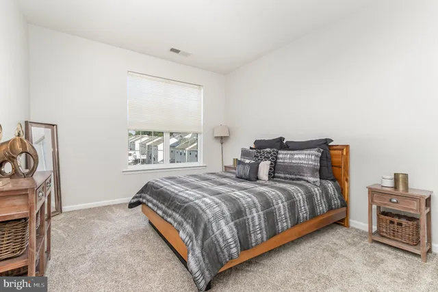 a bathroom with a double vanity sink toilet and shower