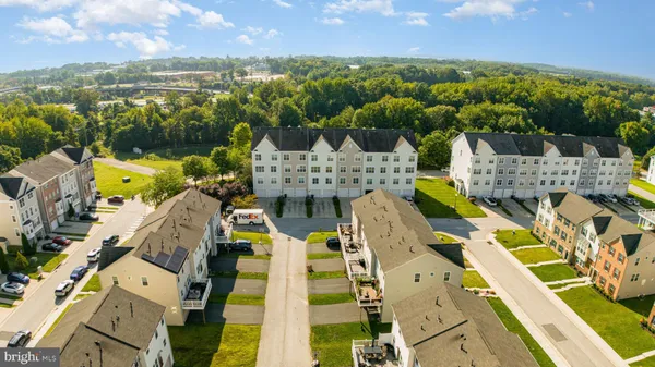 an aerial view of a house with a swimming pool