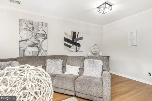 a living room with fireplace furniture and a flat screen tv