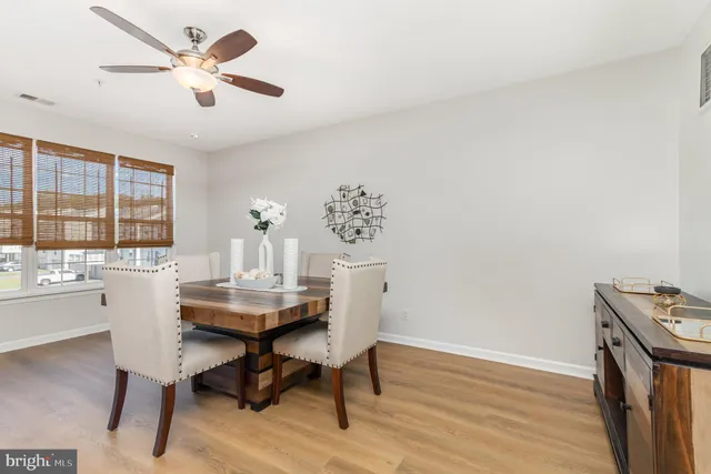 a living room with a flat screen tv and a fireplace