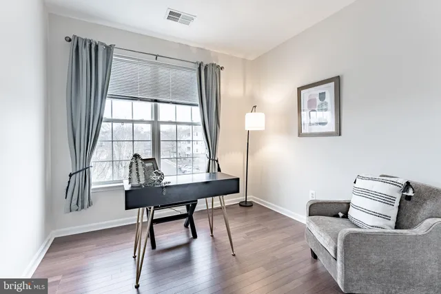 a livingroom with furniture and a window