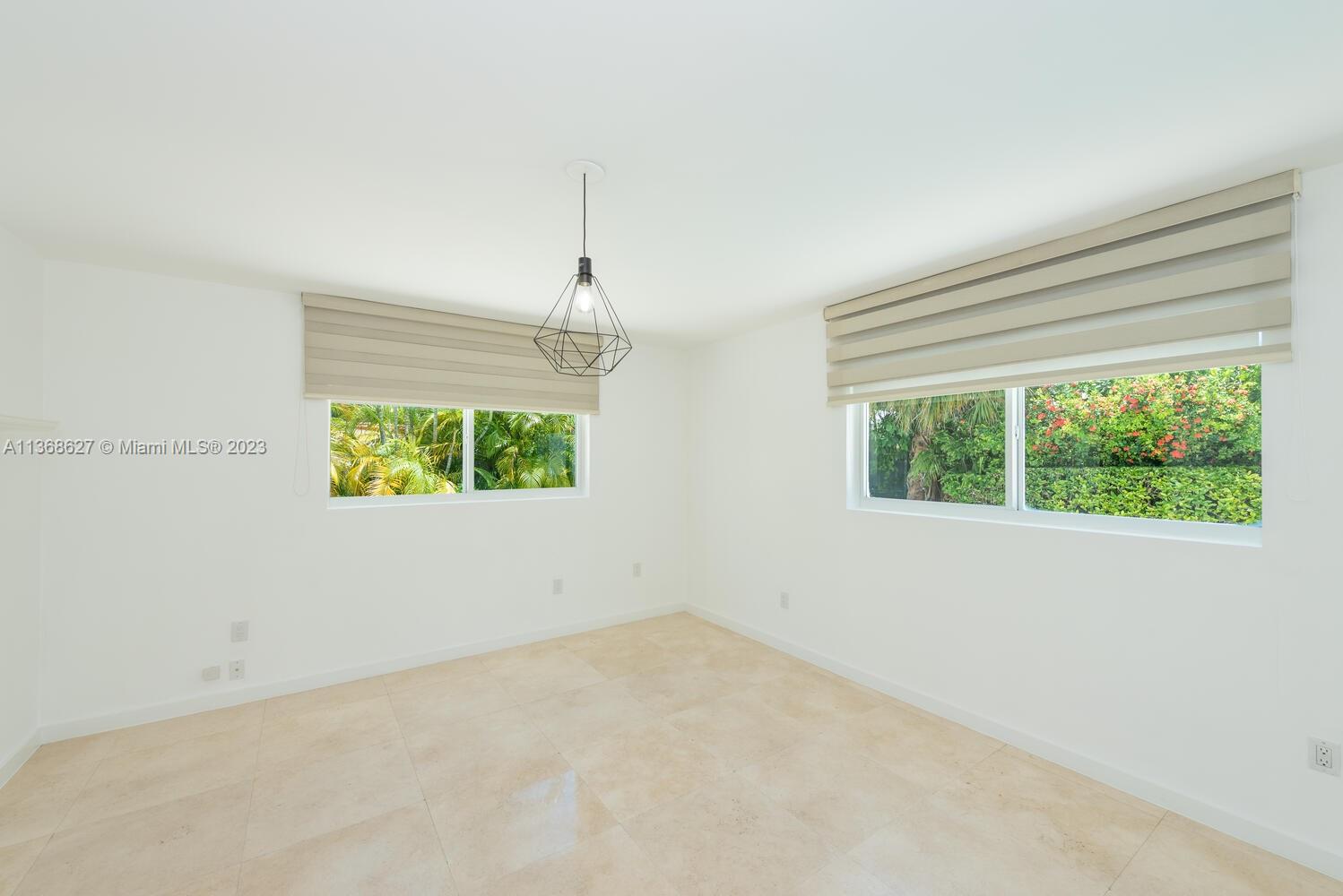 265 Ridgewood Road Key Biscayne, FL 33149 - Photo 8 of 25 a view of a room that has a window