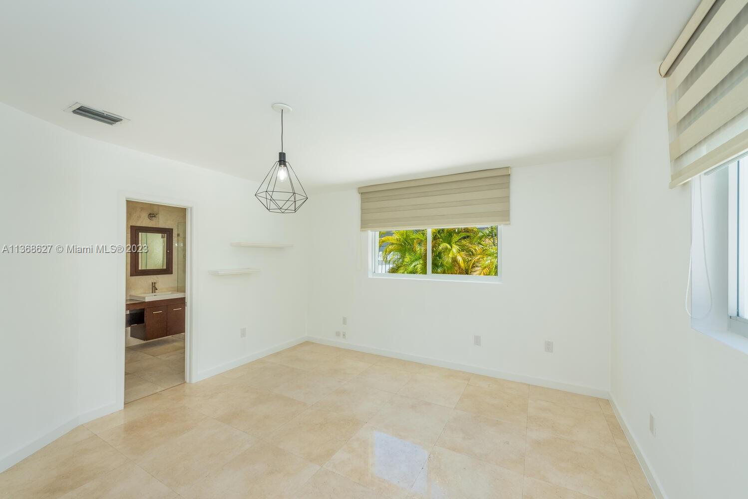 265 Ridgewood Road Key Biscayne, FL 33149 - Photo 9 of 25 an empty room with windows and closet