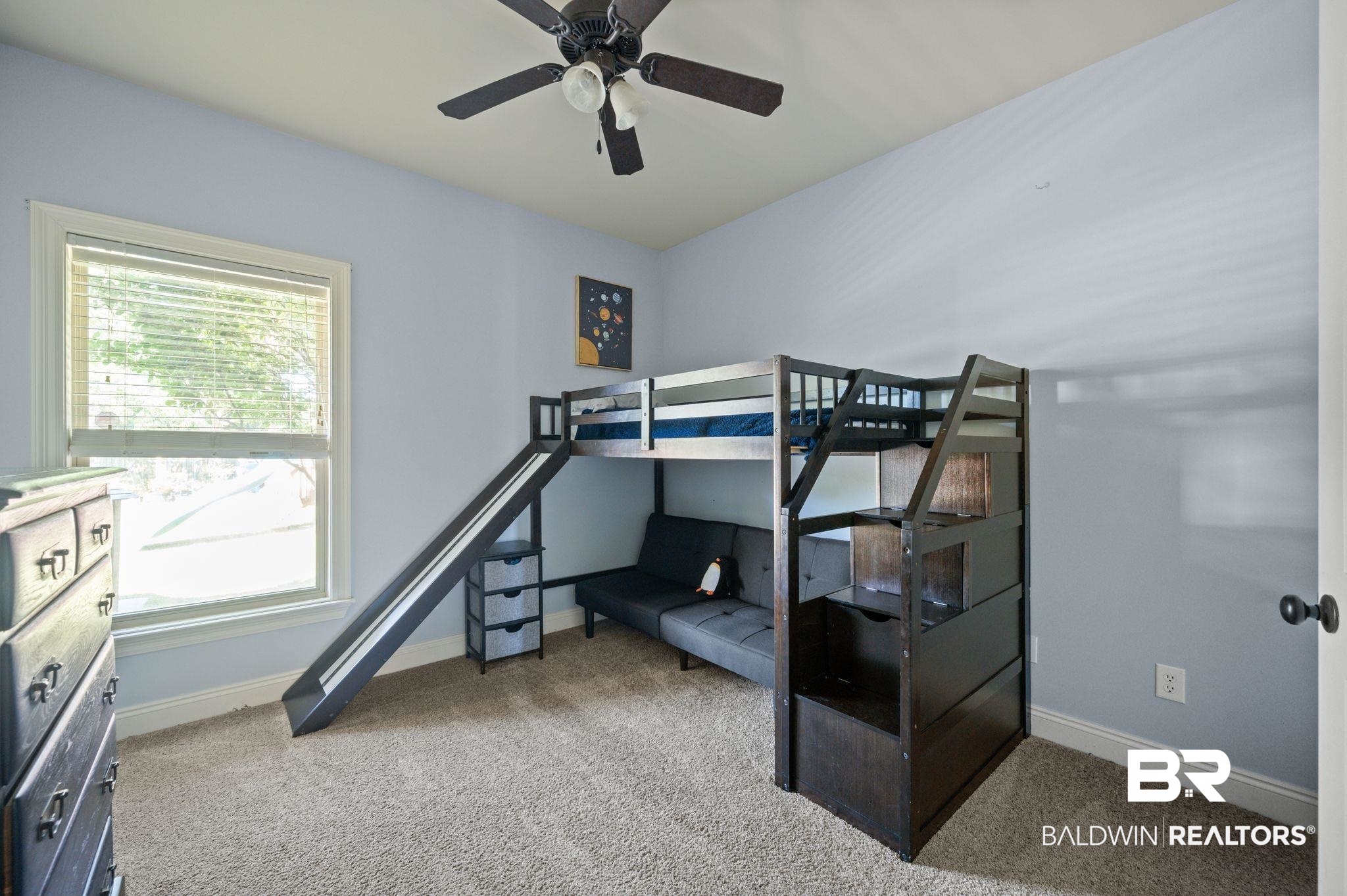 3879 Symphony Way West Semmes, AL 36575 - Photo 26 of 34 Bedroom with ceiling fan and light carpet