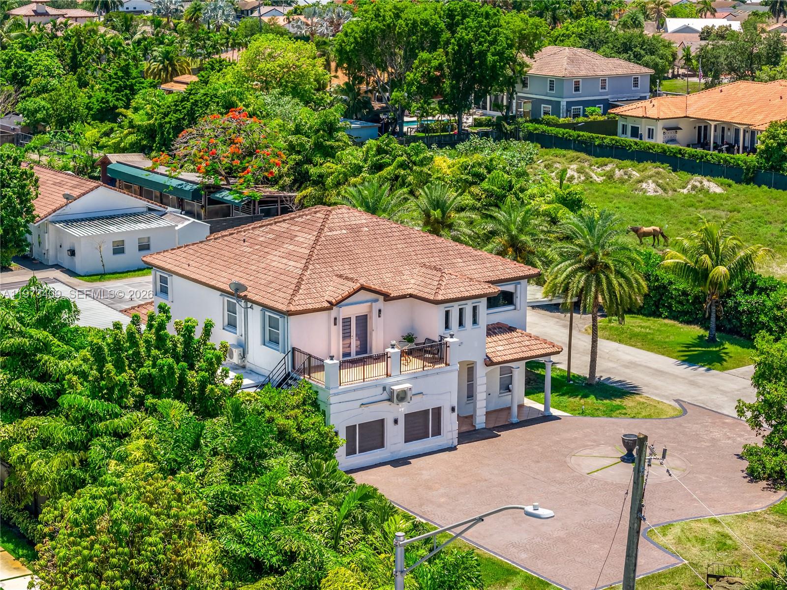 13050 Southwest 26th Street Miami, FL 33175 - Photo 3 of 43 an aerial view of a house with a garden and plants