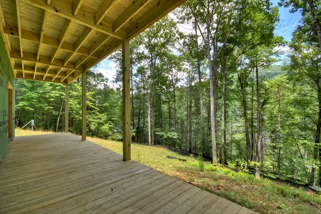 a blue bench sitting in front of a house
