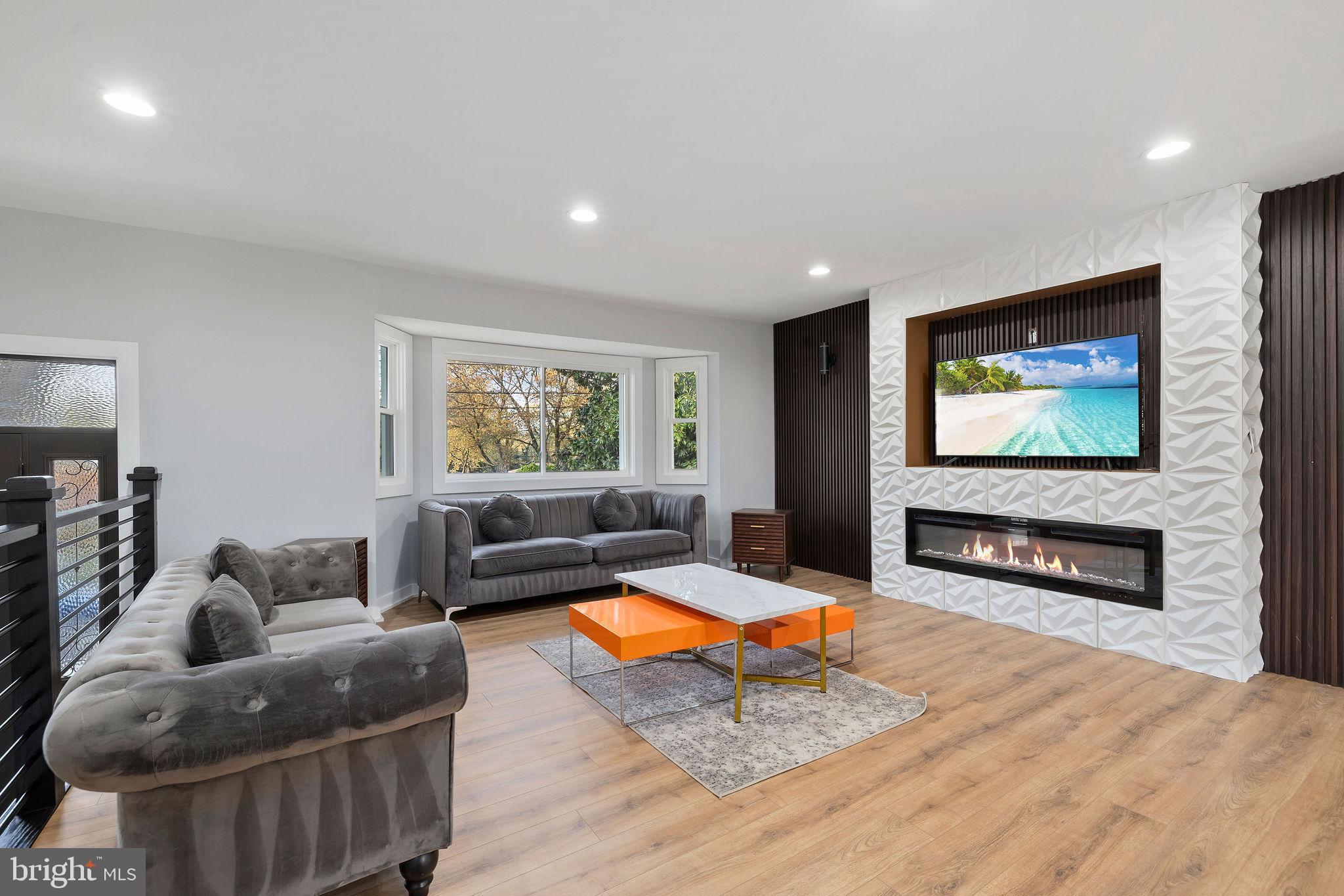 2209 Ellis Street Silver Spring, MD 20910 - Photo 1 of 49 a living room with furniture and a flat screen tv