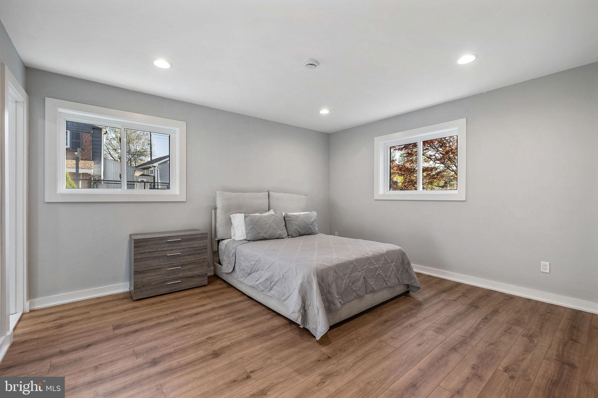 2209 Ellis Street Silver Spring, MD 20910 - Photo 16 of 49 a bedroom with a bed and a painting on the wall