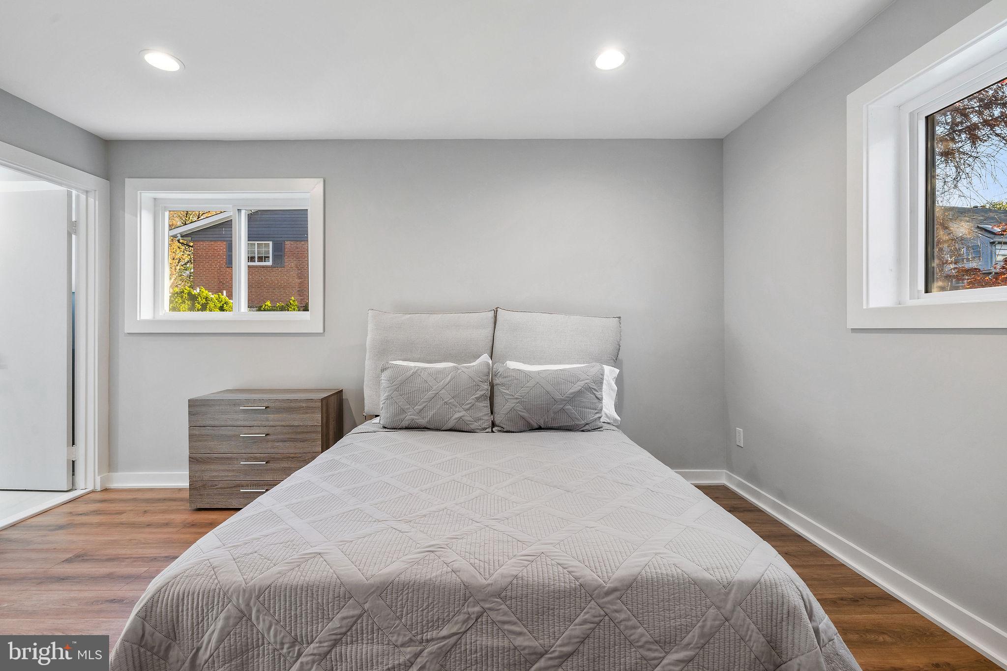 2209 Ellis Street Silver Spring, MD 20910 - Photo 17 of 49 a bedroom with a bed and a painting on the wall
