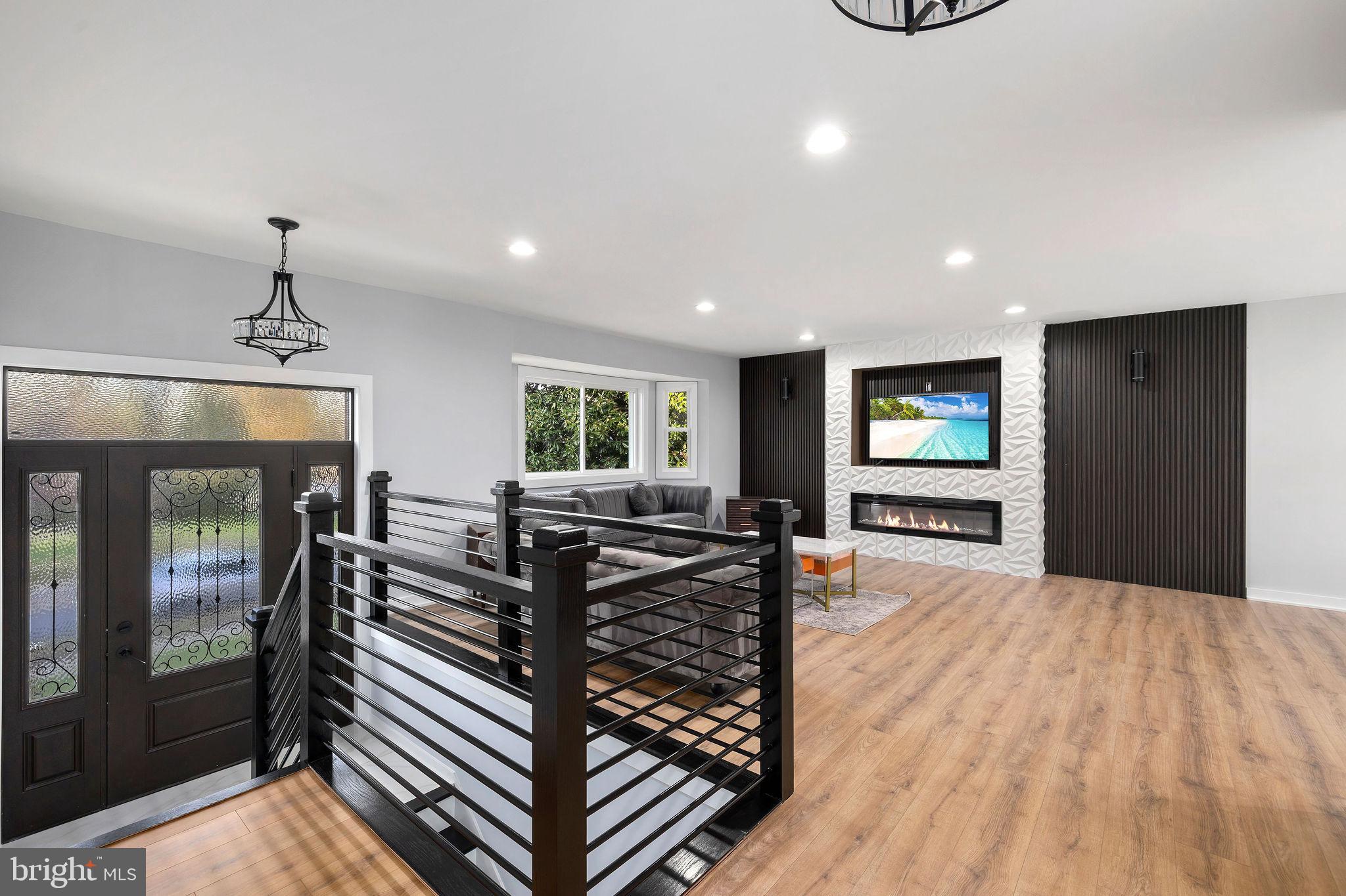 2209 Ellis Street Silver Spring, MD 20910 - Photo 4 of 49 a view of a livingroom with furniture and a flat screen tv