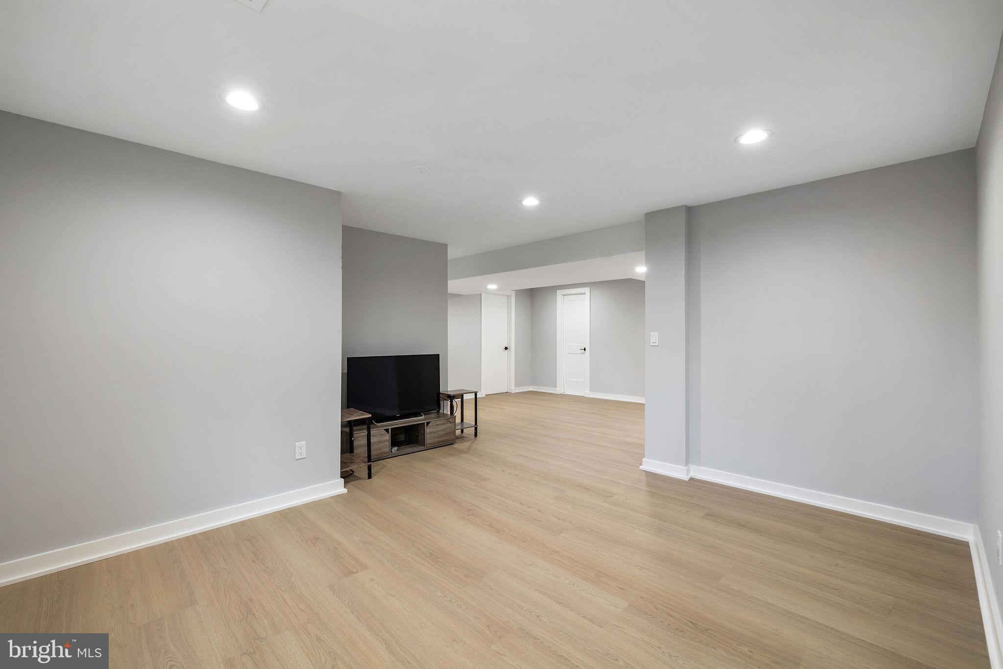 2209 Ellis Street Silver Spring, MD 20910 - Photo 41 of 49 a view of room with window and wooden floor