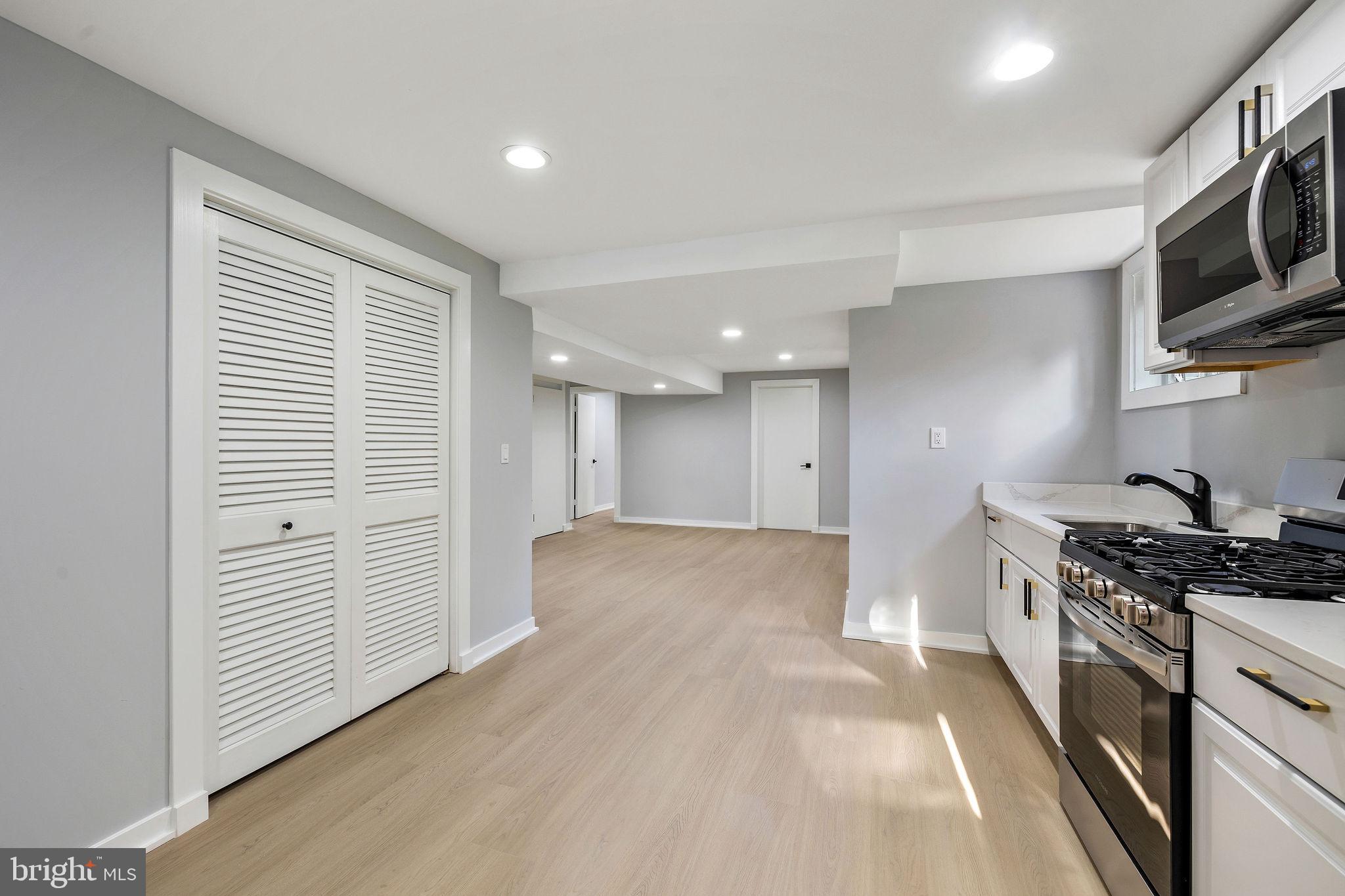 2209 Ellis Street Silver Spring, MD 20910 - Photo 44 of 49 a kitchen with stainless steel appliances granite countertop a stove and a sink