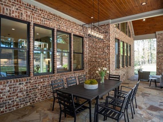 201 Westminster Drive Athens, GA 30607 - Photo 67 of 85 a view of a patio with table and chairs and potted plants
