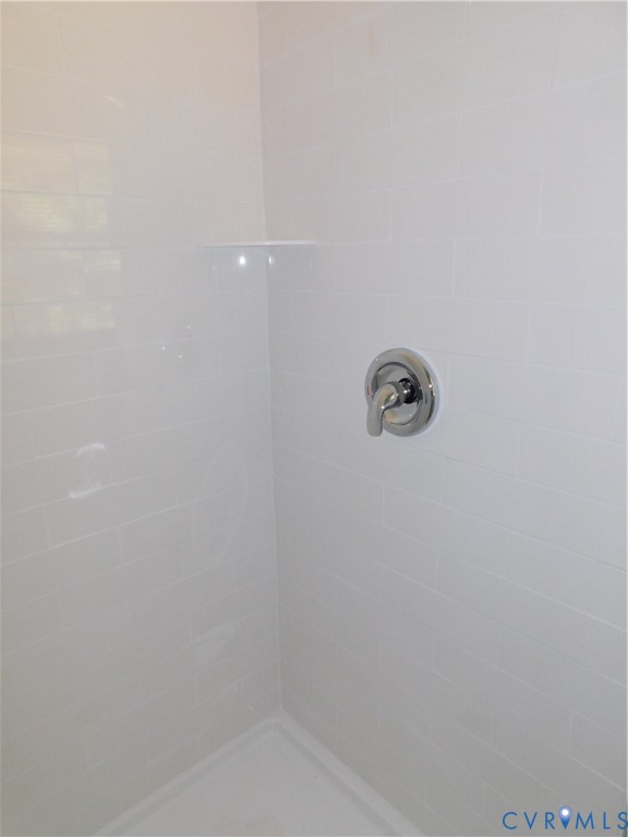 5322 Adams Road Quinton, VA 23141 - Photo 15 of 21 Master bath shower with white ceramic tile surroun