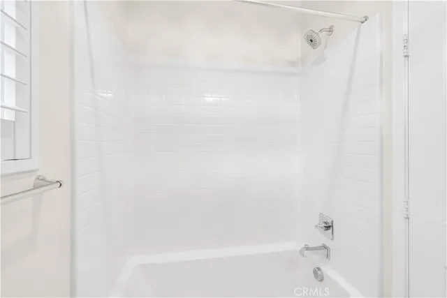 a bathroom with a granite countertop sink mirror and