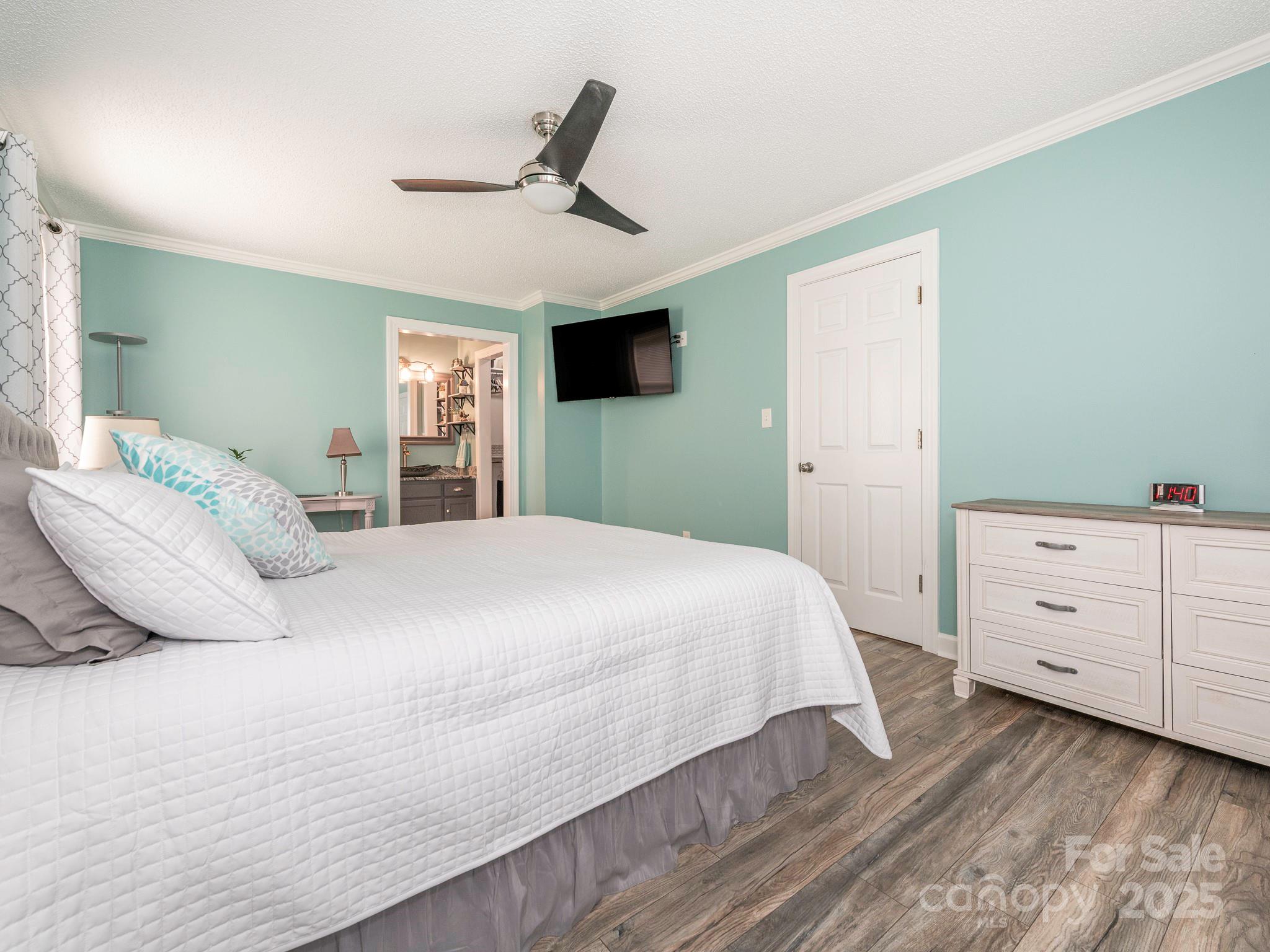 3022 Crestview Lane Lancaster, SC 29720 - Photo 25 of 46 a bedroom with a large bed and a ceiling fan