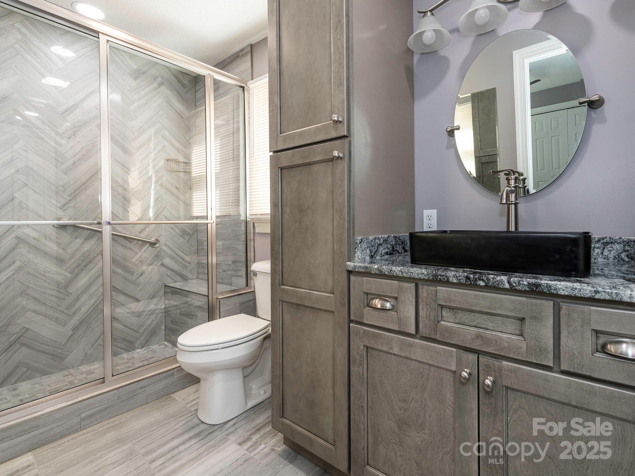 3022 Crestview Lane Lancaster, SC 29720 - Photo 32 of 46 a bathroom with a toilet a sink and mirror