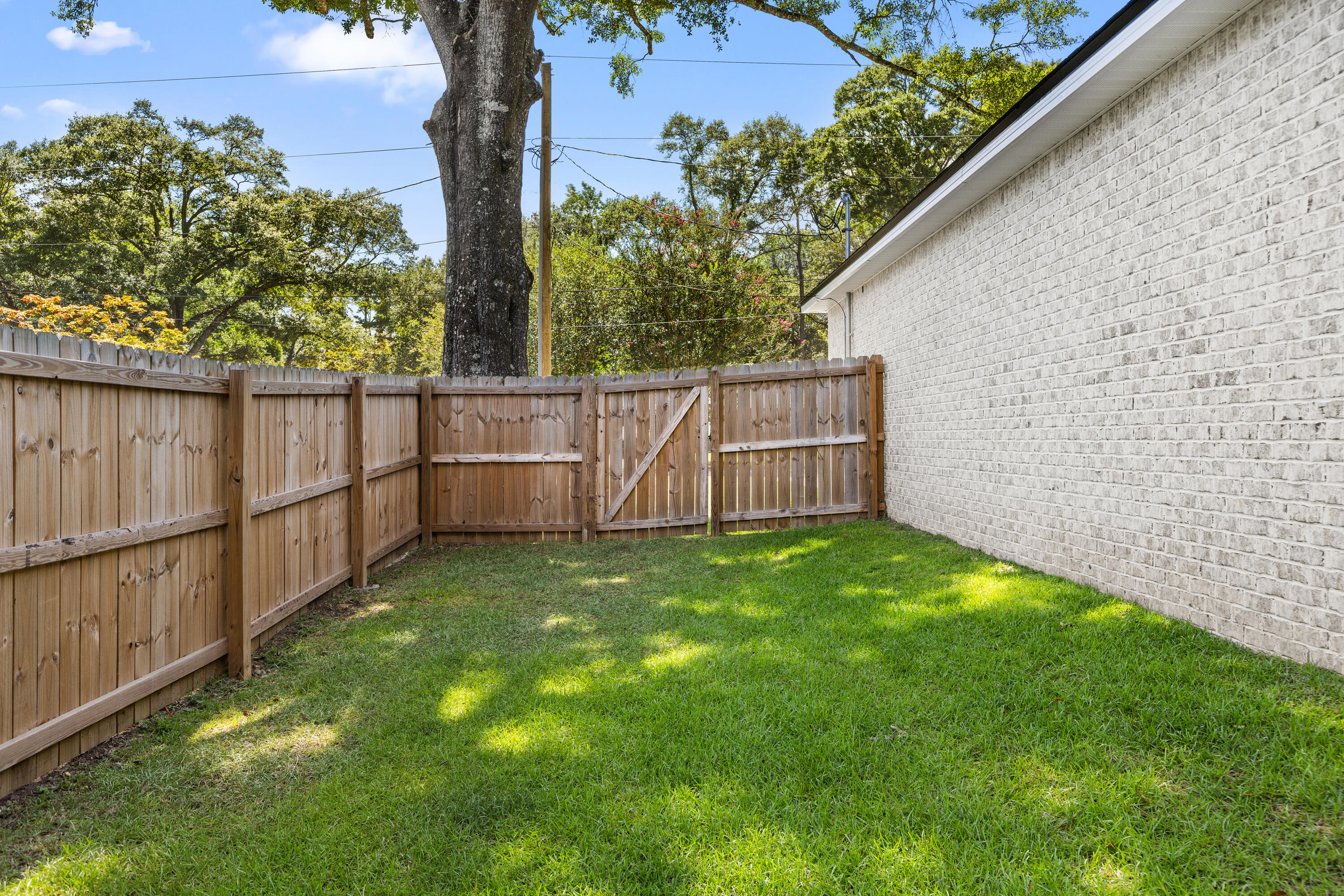 135 Shady Lane Crestview, FL 32536 - Photo 33 of 36 a view of backyard with green space and wooden fence
