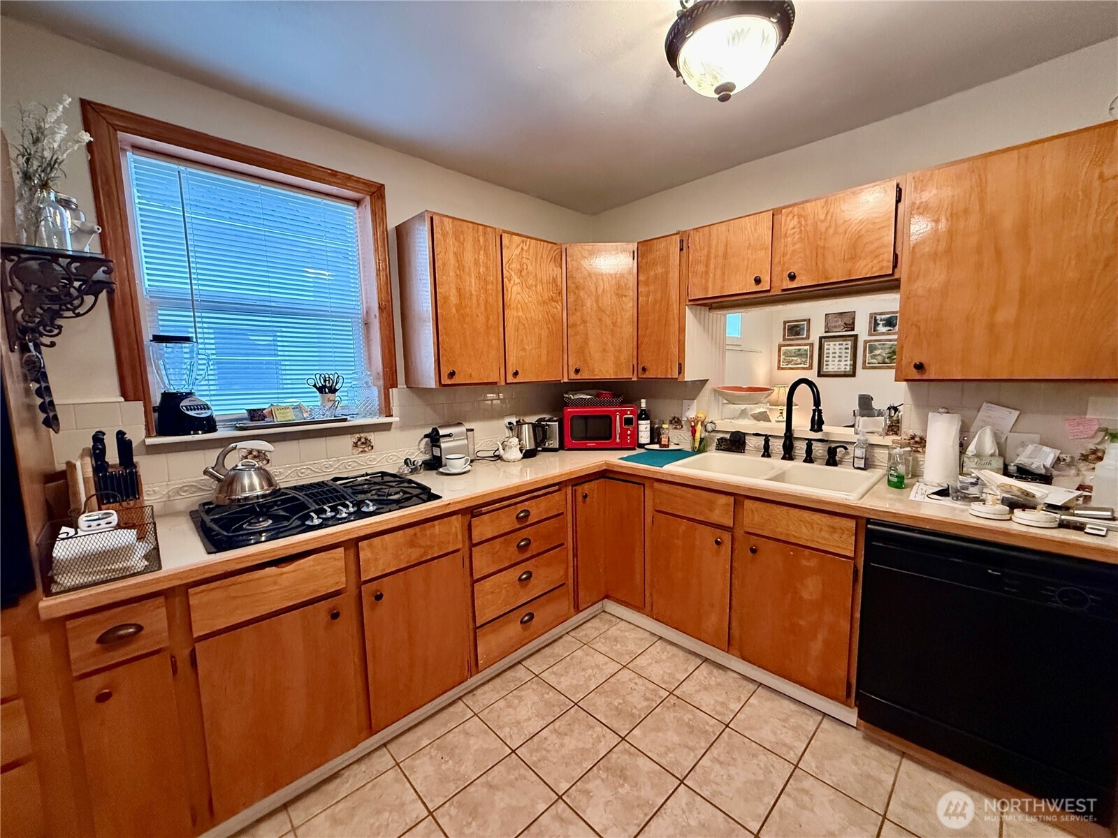 213 East Oak Street Dayton, WA 99328 - Photo 13 of 27 a kitchen with stainless steel appliances granite countertop a sink window and cabinets