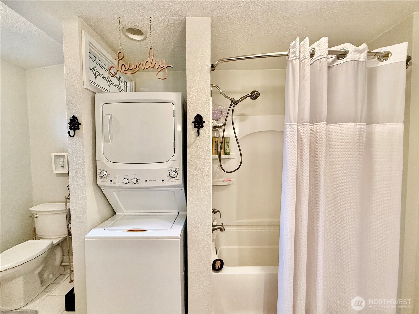 213 East Oak Street Dayton, WA 99328 - Photo 16 of 27 a bathroom with a shower a toilet and a shower