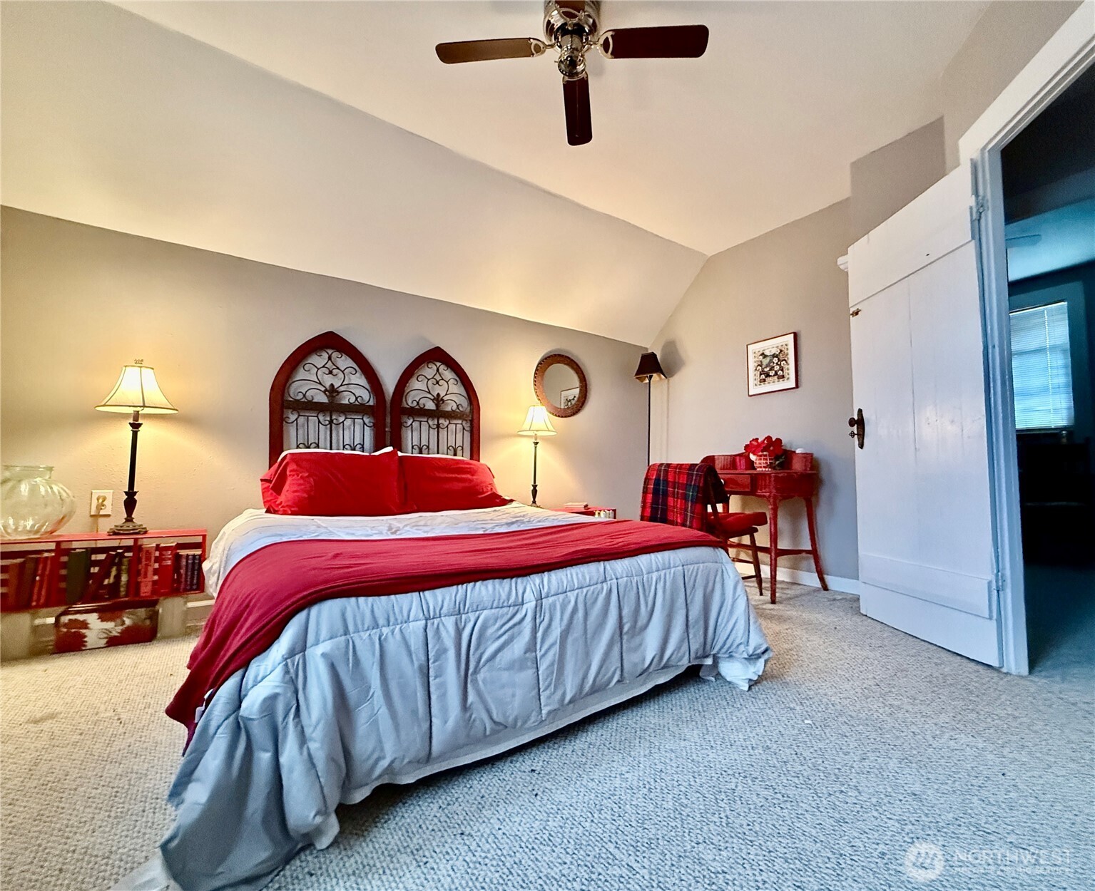 213 East Oak Street Dayton, WA 99328 - Photo 21 of 27 a bedroom with a bed and a chandelier