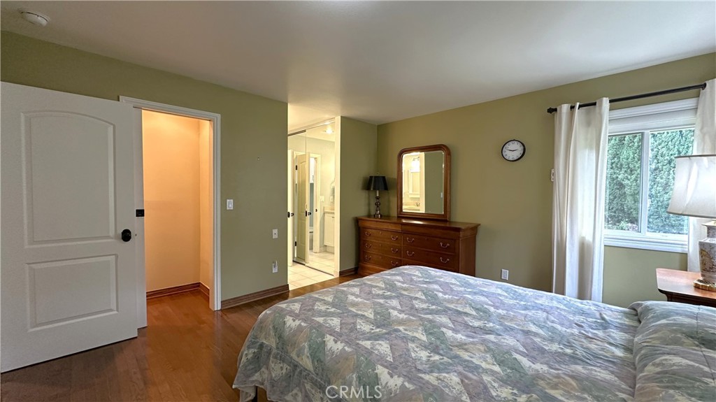 12111 Eddleston Drive Porter Ranch, CA 91326 - Photo 13 of 31 a bedroom with a bed and wooden floor