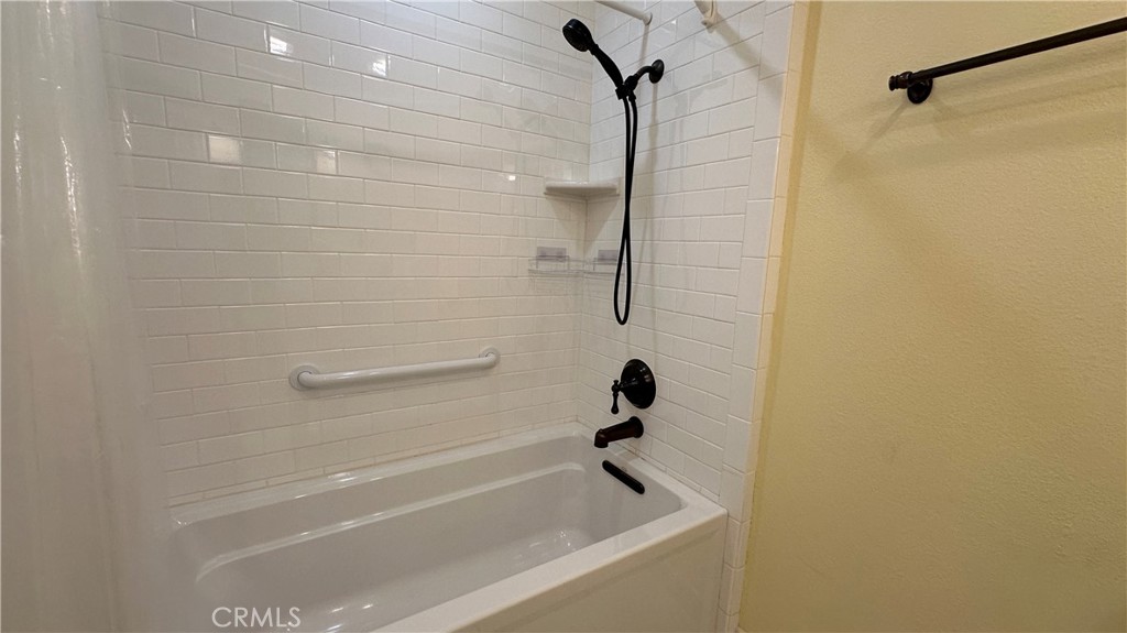 12111 Eddleston Drive Porter Ranch, CA 91326 - Photo 20 of 31 a bathroom with a bathtub