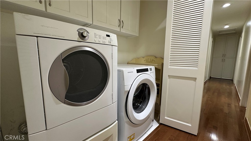 12111 Eddleston Drive Porter Ranch, CA 91326 - Photo 22 of 31 a utility room with dryer and washer