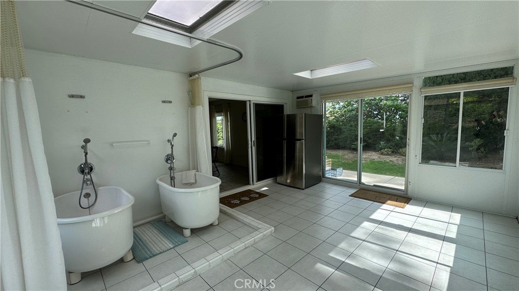 12111 Eddleston Drive Porter Ranch, CA 91326 - Photo 24 of 31 a bathroom with a toilet sink and tub