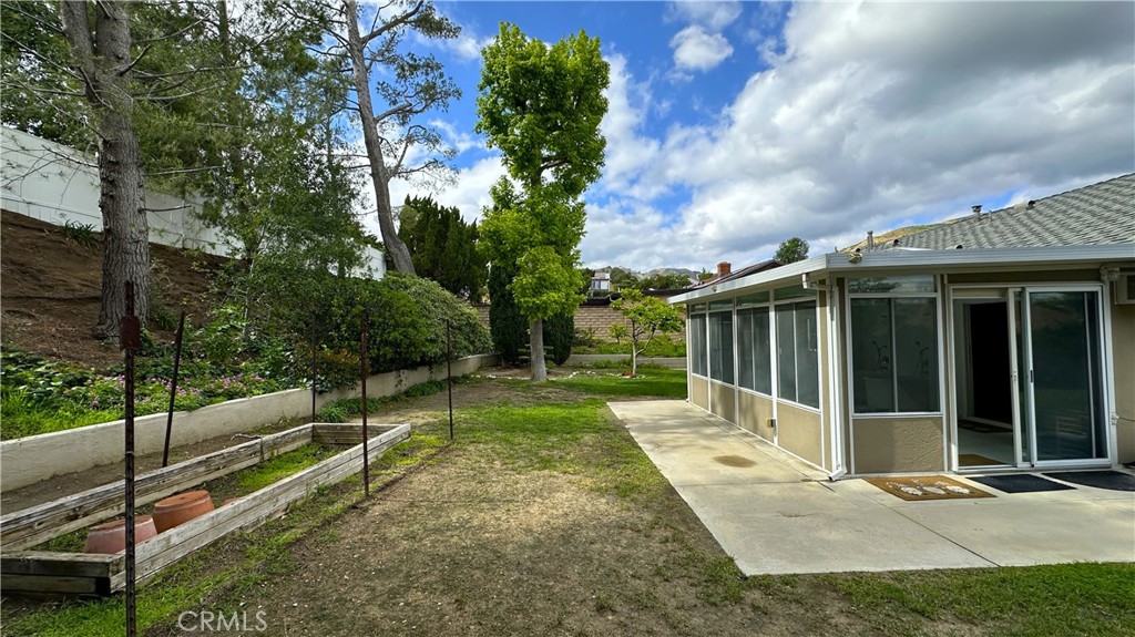 12111 Eddleston Drive Porter Ranch, CA 91326 - Photo 26 of 31 a view of a house with backyard and sitting area