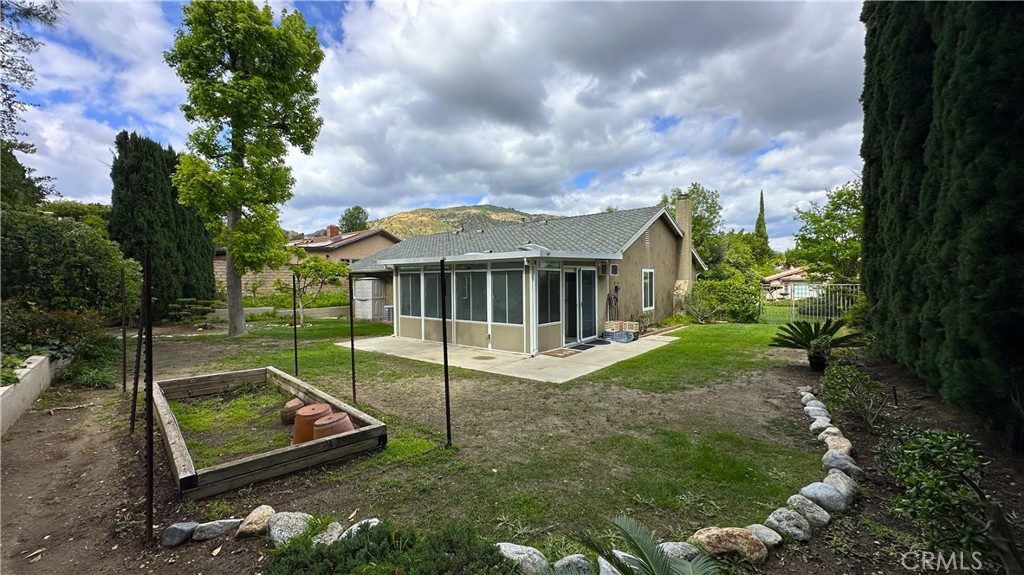 12111 Eddleston Drive Porter Ranch, CA 91326 - Photo 27 of 31 a view of a house with backyard